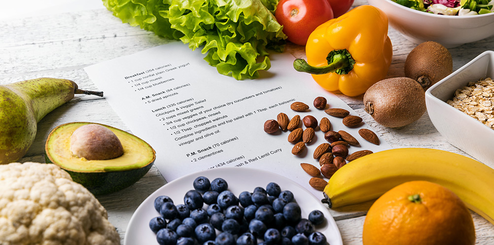 Variety of healthy food and printed nutrition plan